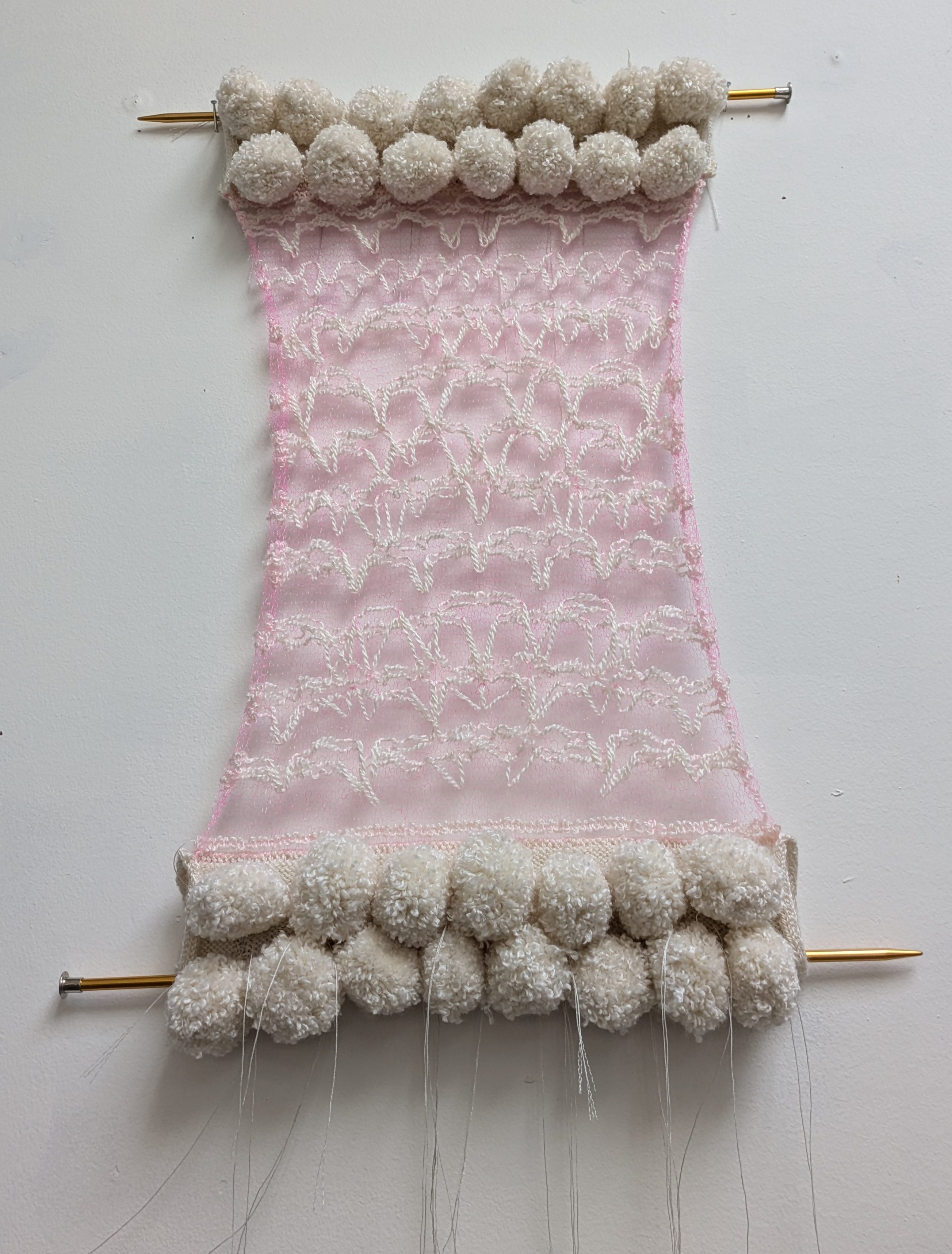 pink cream gray textile art knitting needles abstract puffy monofilament pom poms