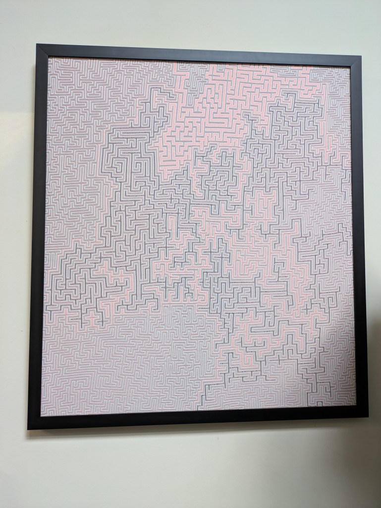 pink black and gray textile sculpture wall art